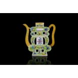 A Chinese Famille vert porcelain "Shou" form wine ewer with yellow brick effect, loop handle, and