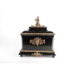 A French Napoleon III ormolu-mounted ebonized table casket with ogee moulded top with key