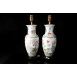 A pair of Chinese famile rose porcelain vase table lamps of baluster form. Printed and painted