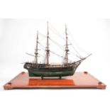 A scale model of the full-rigged HM Bounty with painted detail. Housed in a glazed display case.