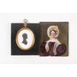 A late 19th century hand-painted portrait on porcelain, depicting a stern-faced lady in wide-