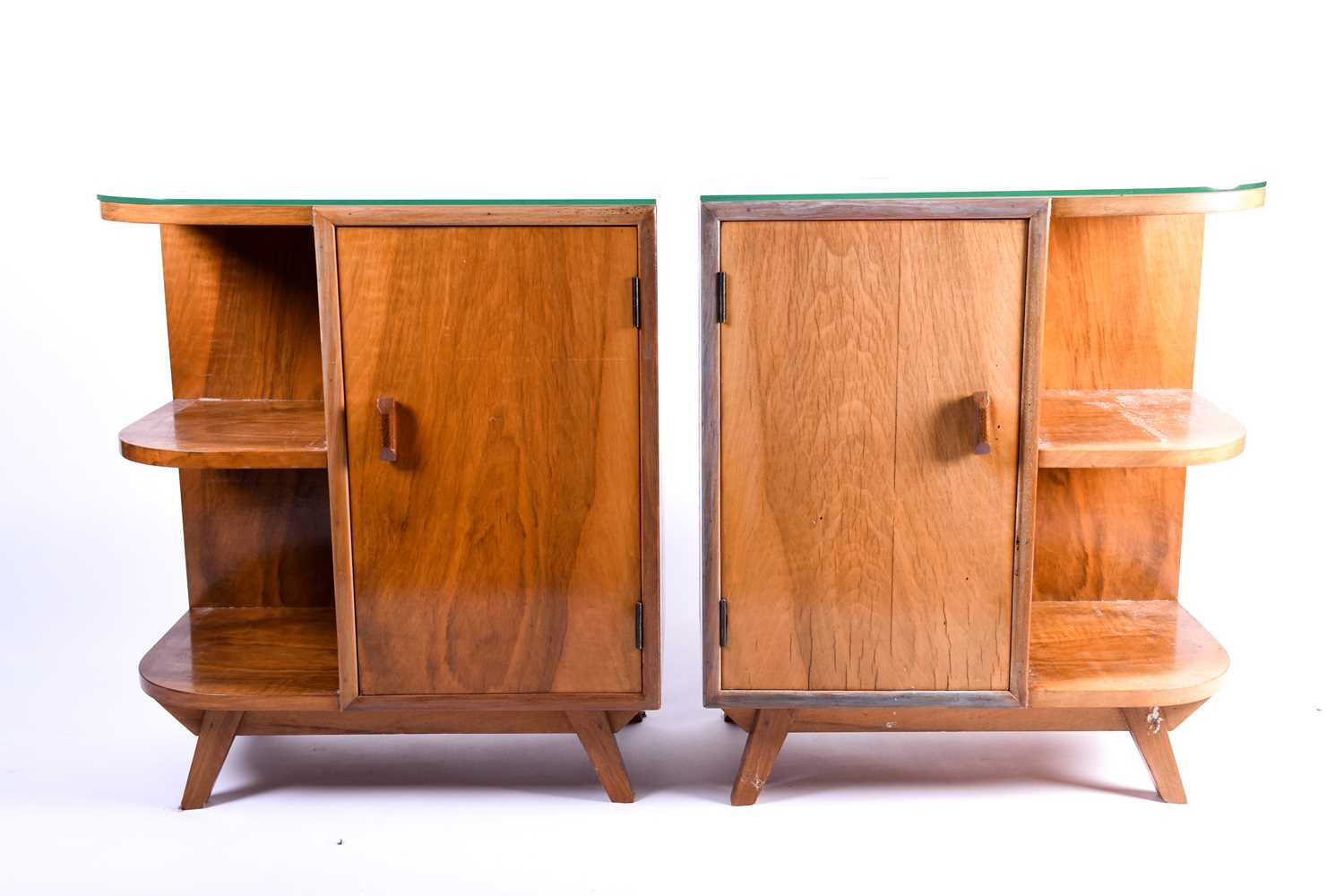 A pair of mid 20th century figured walnut bedside cabinet bookcases, each radiused at one end and