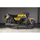 A 1980 Yamaha RD200 200cc yellow motorcycle, Registration: HPK 594V Odometer showing 23,826 miles.