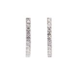 A fine pair of diamond earrings, each set with round brilliant-cut diamonds to the front of the