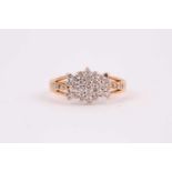 An 18ct yellow gold and diamond cluster ring, set with small round-cut diamonds (one lacking),