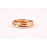 A Cartier 'Trinity' three colour gold ring; in white, yellow and rose gold, designed as a trio of