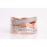 A two colour, four row, diamond set cross-over ring; one band with channel set princess cut