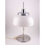 A Harvey Guzzini chrome and plastic table lamp, with adjustable shade