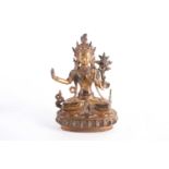 A possibly Tibetan gilt bronze seated padmapani bodhisattva, set with turquoise and coral beads,