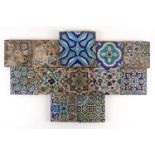 Twelve Persian Isnik tiles, 19th century, principally floral designs, most 15.5cm square, large tile