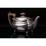 A George V silver teapot, Chester 1933 by S. Blanckensee & Sons Ltd, of rectangular form on four