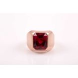 A gentleman's 9ct rose gold ring, set with a rectangular-cut red paste stone, size P 1/2.