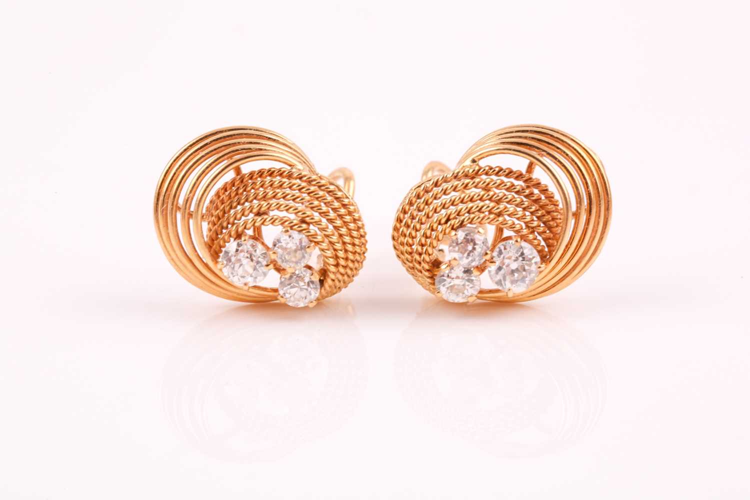 A pair of 18ct yellow gold and diamond earrings, each with a swirled rope-twist mount set with three - Image 2 of 6