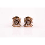 A pair of diamond cluster earrings, the cruciform clusters set with thirteen vari-sized round