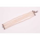 Tiffany. A five row uniform-sized freshwater pearl bracelet, with silver mounts, trigger clasp