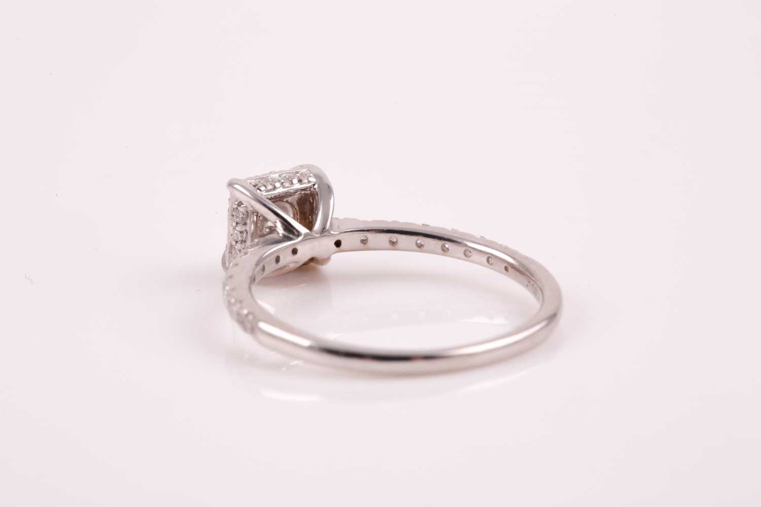 A 14ct white gold and diamond cluster ring, set with a round brilliant-cut diamond of - Image 5 of 7