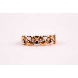 An 18ct yellow and white gold and diamond ring, set with alternating bi-coloured gold hearts, and