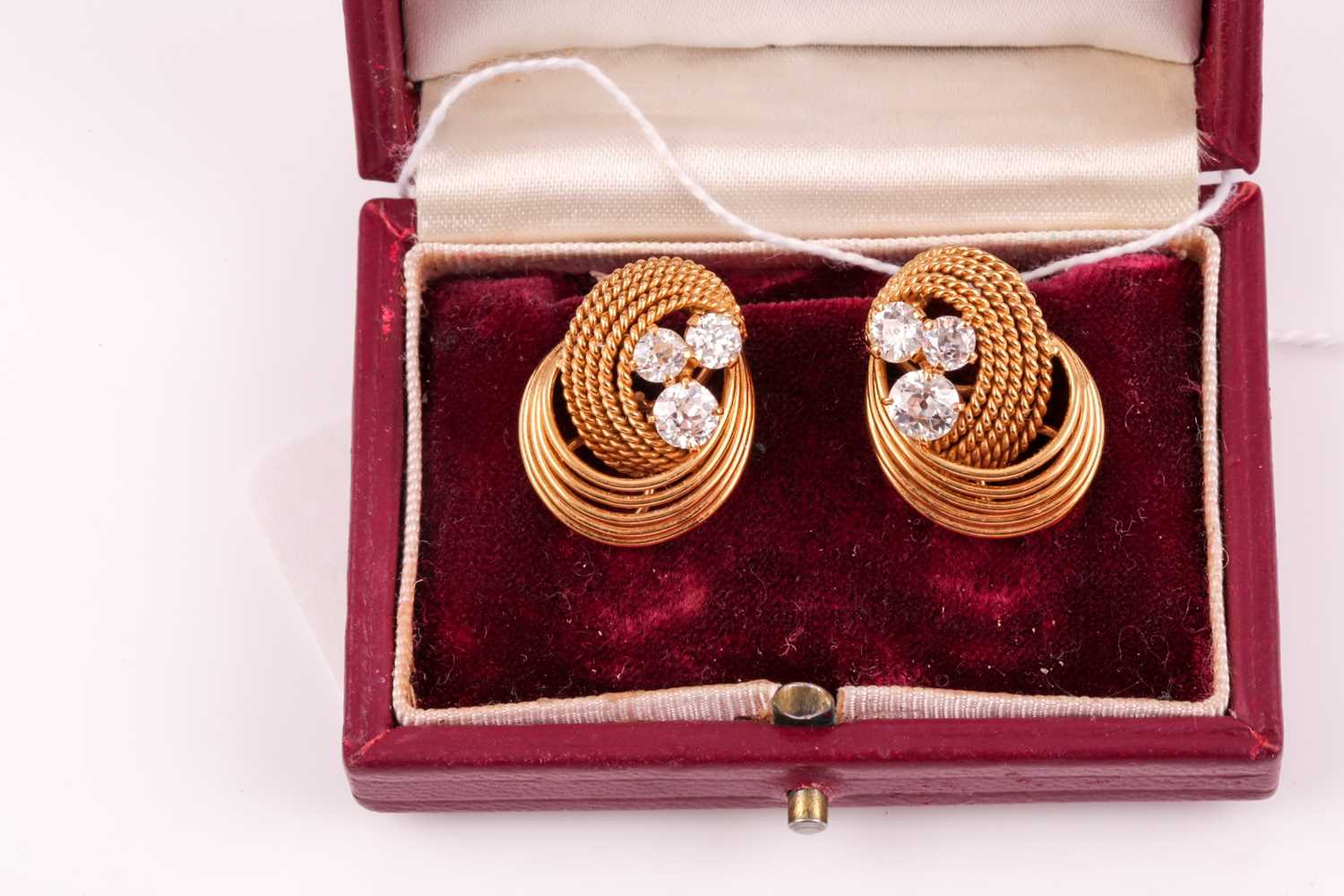 A pair of 18ct yellow gold and diamond earrings, each with a swirled rope-twist mount set with three - Image 6 of 6