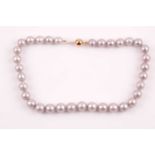 A pale grey freshwater pearl necklace, suspended with rounded silvery grey pearls, approximately