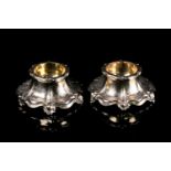 A pair of Victorian silver gilt salts by Charles Thomas Fox and George Fox, the round cellars with