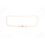 A graduated cultured pearl necklace, the clasp set to one side, the pearls ranging from