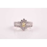 A 14ct white gold and diamond cluster ring, centred with a pear-cut fancy-yellow diamond of