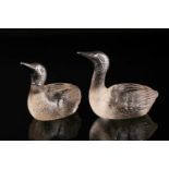 A novelty pair of white metal and glass salts in the form of ducks, with white metal heads, marked