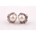 A pair of diamond and pearl cluster earrings, each set with a South Sea pearl approximately 11 mm