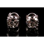 A pair of round brilliant-cut diamond earrings, of approximately 4.0 carats , approximate colour /