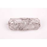 A platinum and diamond plaque brooch, of foliate design, inset with round-cut diamonds, total