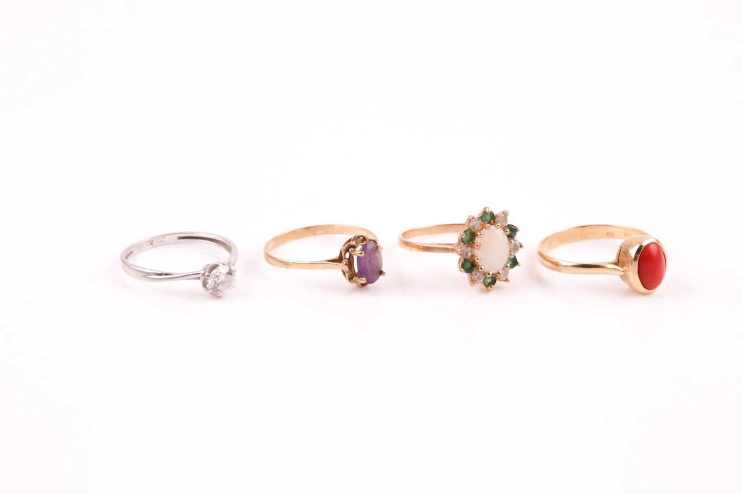 A single stone coral ring, the yellow metal mount marked '585'; a single stone amethyst ring, an - Image 4 of 5