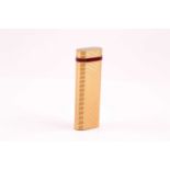 Cartier. A Must De Cartier gold plated cigarette lighter, with red enamel band to upper part of