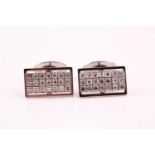 A pair of diamond cluster cufflinks, the rectangular plaques pave set with twenty one round