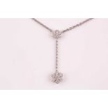 An Italian diamond double cluster pendant, the principle seven stone round brilliant-cut diamond