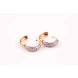 A pair of diamond set hoop earrings, the fronts set with proud brilliant cut diamonds in pave set