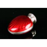 A silver and enamel scent bottle, of oval design, engine-turned with red enamel decoration, the