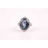 A 14ct white gold, diamond, and sapphire ring, set with a mixed oval-cut colour-change sapphire,