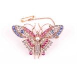 A diamond, ruby, and sapphire butterfly brooch, late 19th / early 20th century, the abdomen set with