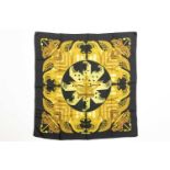 A Hermes "Proues" pattern silk scarf with galleons and anchors in tones of yellow on a black