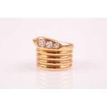 An 18ct yellow gold and diamond snake ring, the snake head set with three graduated old-cut diamonds