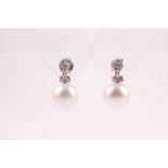 A pair of diamond and pearl drop earrings, each with a round white pearl, approximately 10 mm