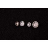 A group of four round brilliant-cut loose diamonds, the largest approximately 0.46 carats, I3