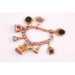 A 9ct rose gold Victorian curb-link charm bracelet (with later replacement yellow gold clasp),