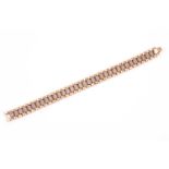 A diamond bracelet, three rows of fluted links, the central panel pave set with single cut diamonds,