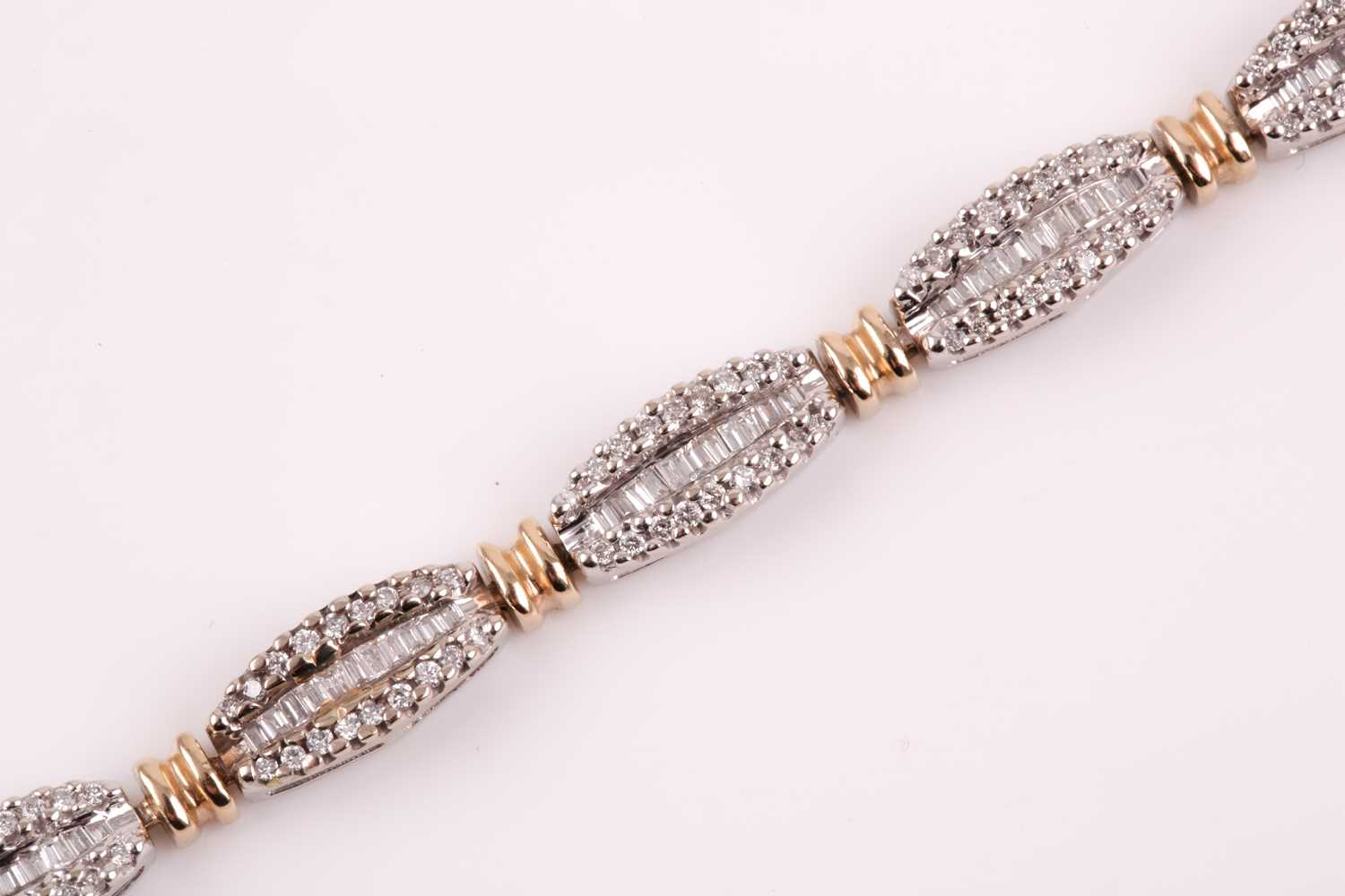 A diamond line bracelet, the tapered segments inset with mixed baguette-cut and round-cut - Image 6 of 7