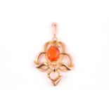 An Art Nouveau yellow gold and fire opal pendant, the openwork mount set with a mixed oval-cut