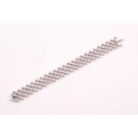 An 18ct white gold and diamond lattice bracelet, collet-set with round brilliant-cut diamonds,