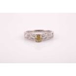 Harr & Jacobs. A 14ct white gold and diamond ring, centred with a cushion-cut fancy intense yellow