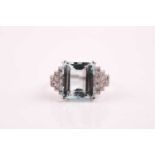 A platinum, diamond, and aquamarine ring, in the Art Deco taste, set with a rectangular-cut