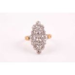 A yellow metal and old-cut diamond navette-shaped ring, the mount inset with mixed old-cut diamonds,